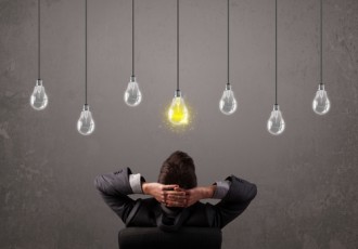 St. Louis IP Attorney Bryan Wheelock Discusses "Lit Year" Metric with <i>Inside Counsel</i> | IP Law Firm | Harness IP shutterstock lightbulb and man | Intellectual Property Law Firm | Harness IP