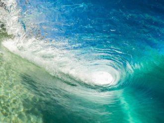 Endless Litigation | IP Law Firm | Harness IP image of curling wave to evoke connection between endless summer and endless litigation